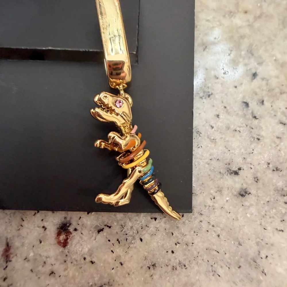 NWT Coach Skeletal Rexy Huggie Earrings - Picture 3 of 4